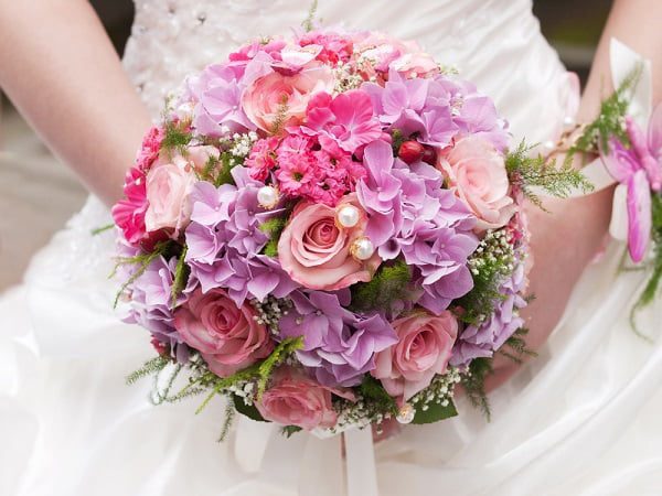 round traditional wedding bouquet - The Planners
